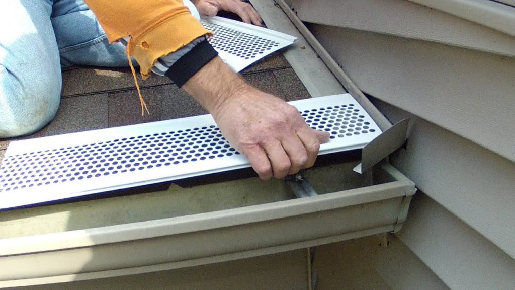 Leaf guard system installed over residential eavestroughs in Whitby to prevent clogs